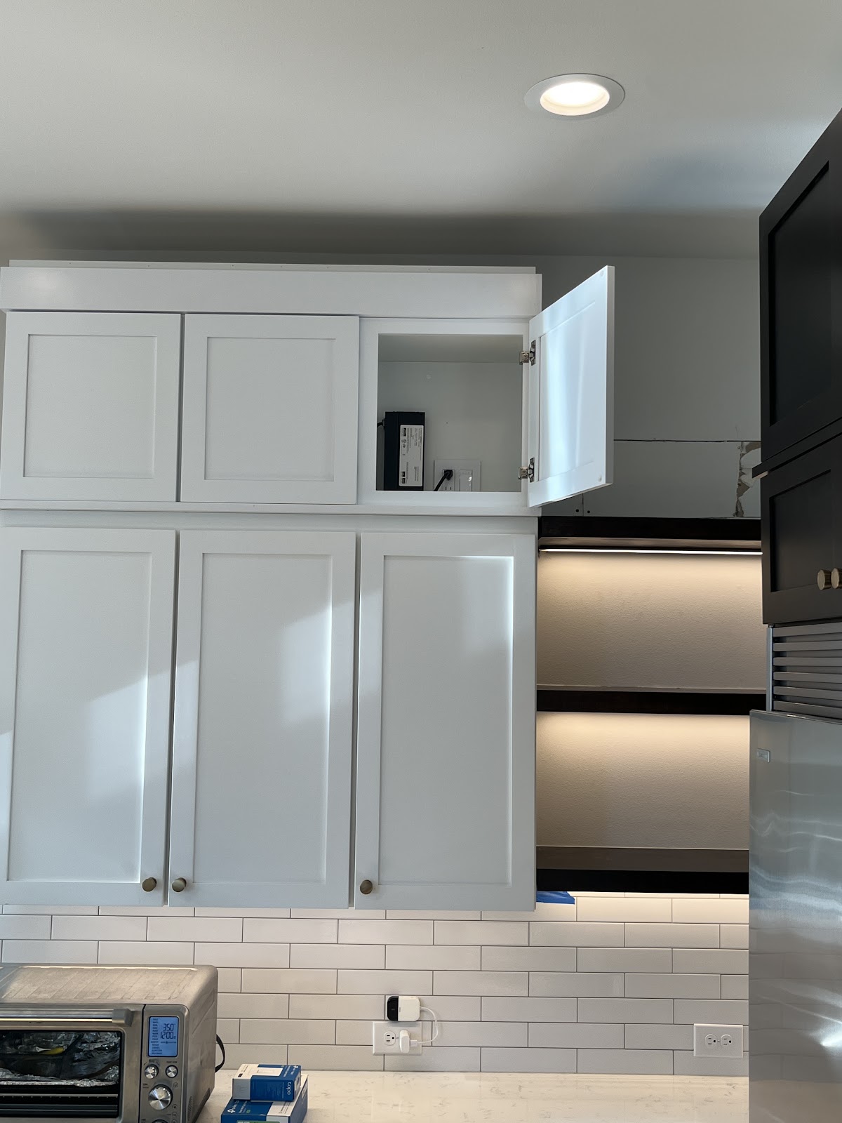 Kitchen cabinets with lighting at the work surface