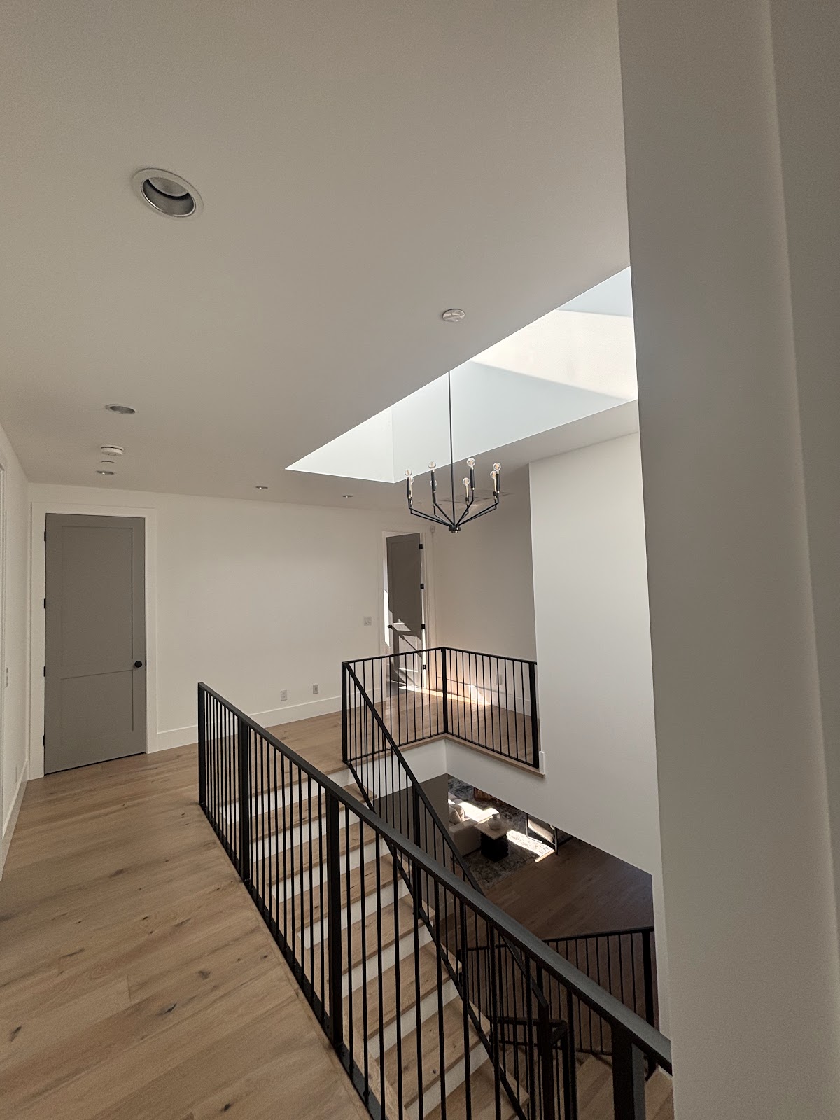 Upstairs residential room with ceiling lights