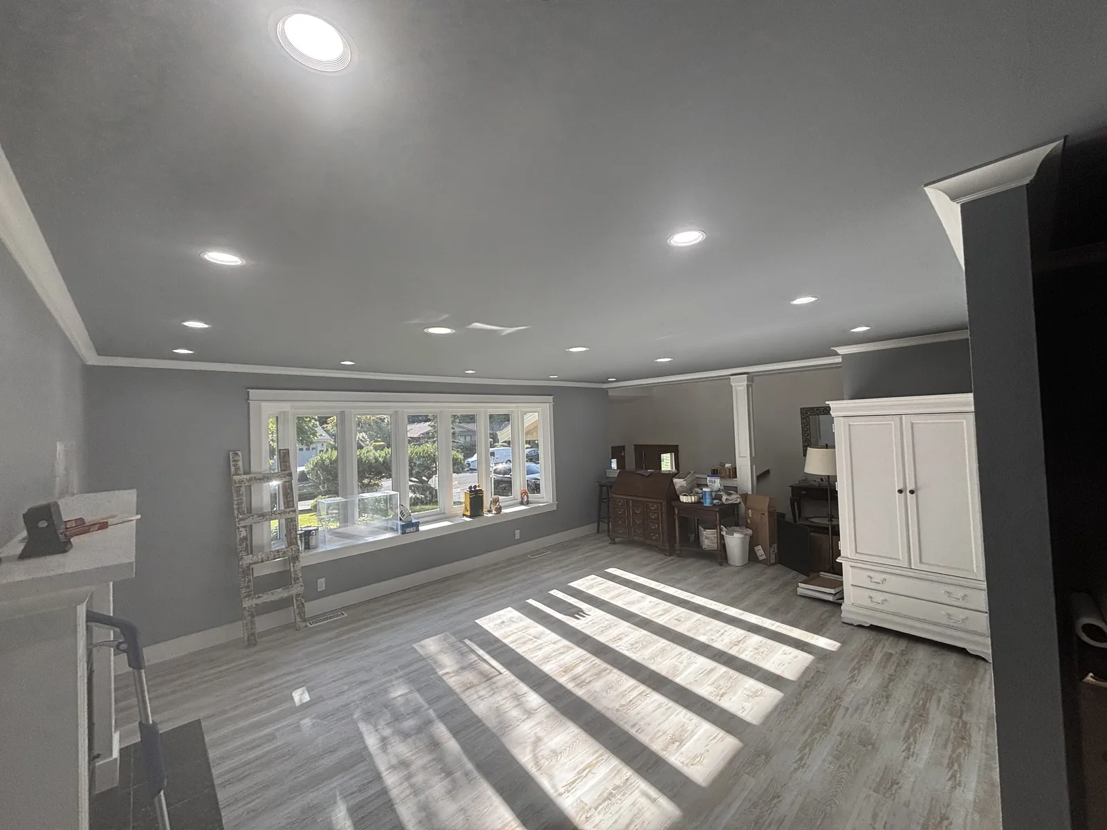 Living room with recessed ceiling lights viewed from the far corner